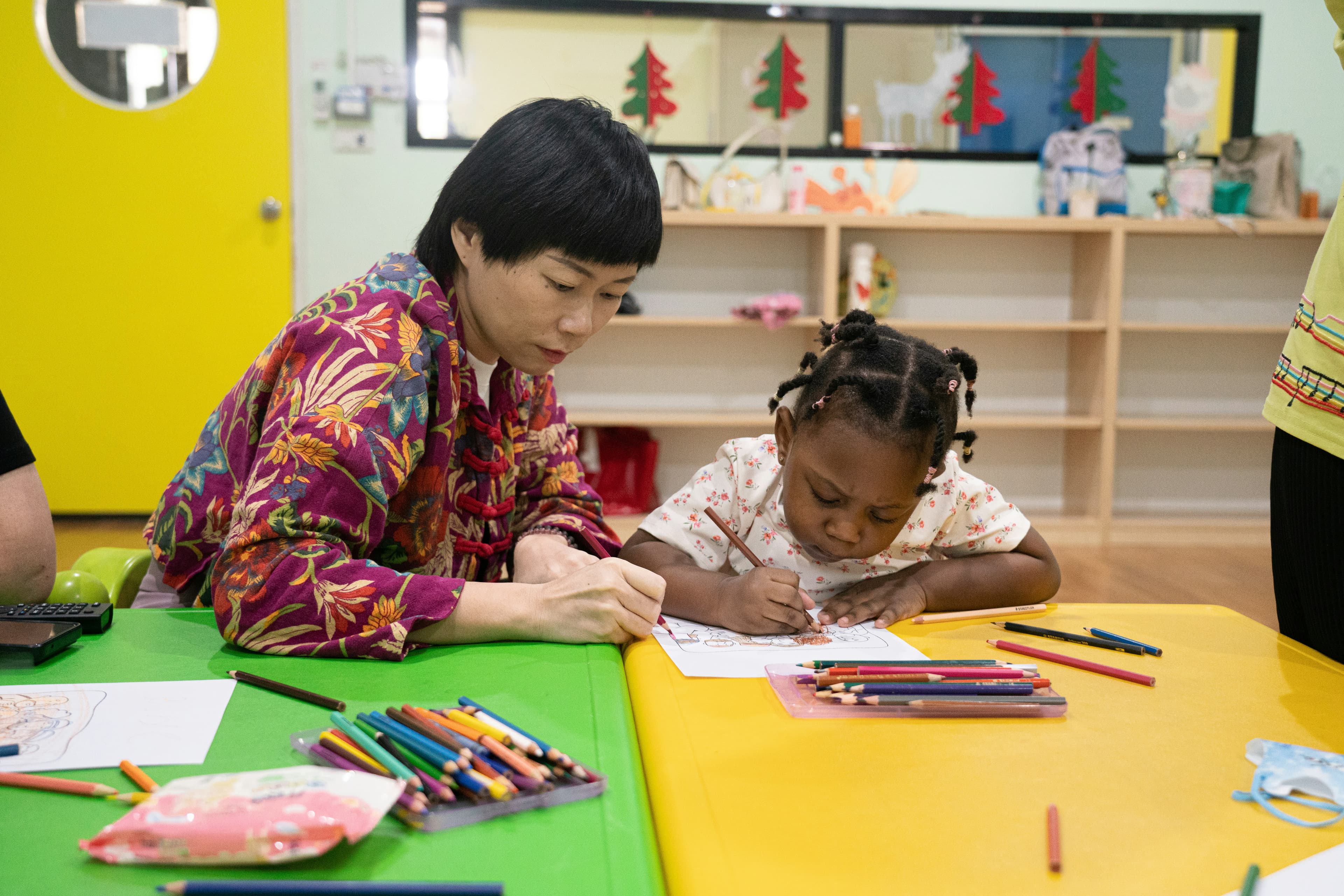 Teacher working with a child